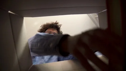 Man unpacking a parcel Stock Footage 81482580