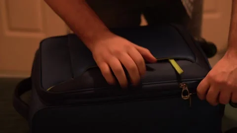 Man Unpacking Suitcase Stock Footage 170804455