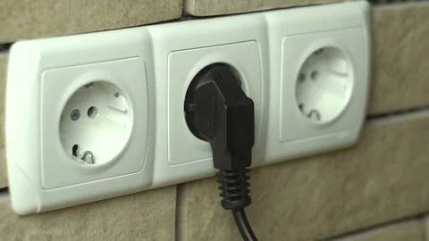 Man Unplug And Push Electric Plug Into The Socket Stock Footage 101027499