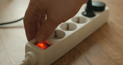 Man unplugging electrical plugs Stock Footage 88731472