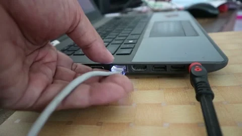 Man unplugs Network Cable from laptop. Disconnect internet Stock Footage 196803358