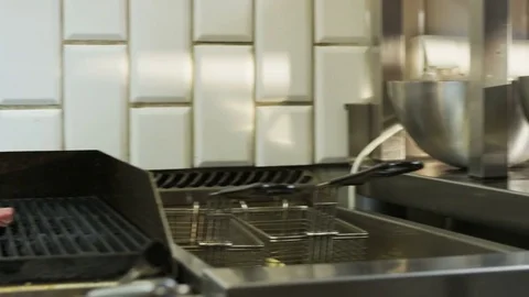 Man Unwrapping Meat and Putting it on a Grill Stock Footage 71564403