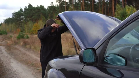 A man upset about a car breakdown Stock Footage 142922343
