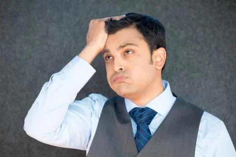 Man upset with hand on head Stock Photos