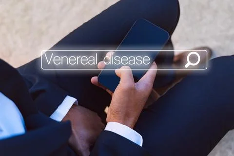 Man with urology problems searching in internet about venereal disease Stock Photos