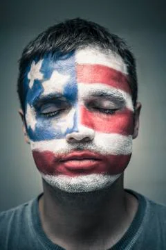 Man with usa flag on face and closed eyes Stock Photos
