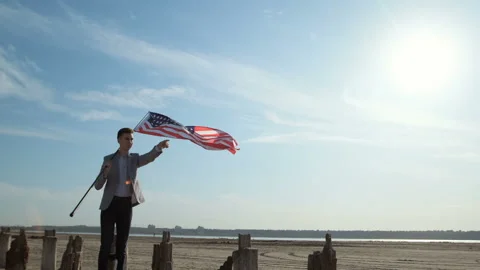A man with a USA flag in his hands. Stock Footage 137948973