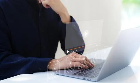 Man use computer for streaming online on virtual screen, watching video. Stock Photos