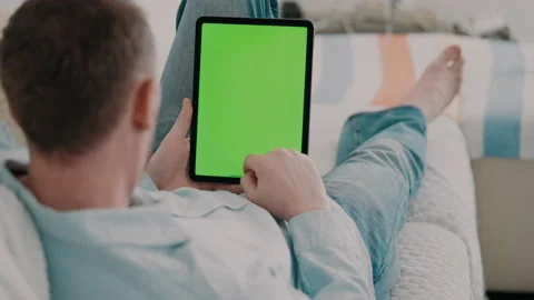 Man use device with green screen Stock Footage 229701792