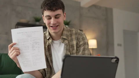 Man use digital tablet show papers letter document video call at home Stock Footage 264651129