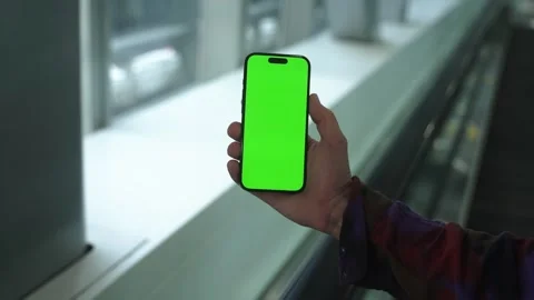 Man use display smartphone on the escalator. Green screen phone. Close up Stock Footage 265134566