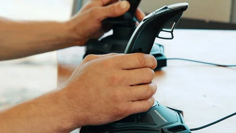 Man use interactive simulator. Simulator ride. Driver learning drive on joystick Stock Footage 94617560