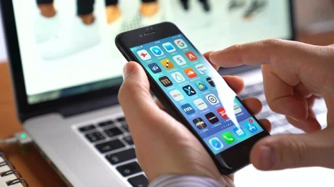 Man use iphone to shop online Amazon app on the screen Stock Footage 85886959