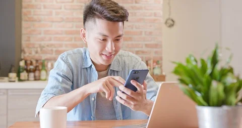 Man use notebook and phone Stock Footage 89635353