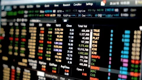 Man use pen point to Data graph of stock market financial chart Stock Footage 80250161