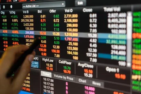 Man use pen point to Data graph of stock market financial chart Stock Photos