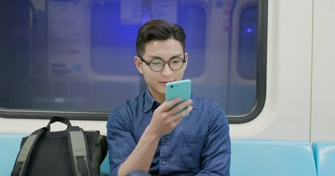 Man use phone in MRT Stock Footage 109165227