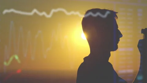 The man use the professional camera against the sun on holographic background Stock Footage 133723015