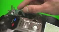 The man use the remote control for the drone on a green background. Real time 4k or 4k+ Resolution