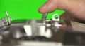 The man use the remote control for the drone on a green background. Real time 4k or 4k+ Resolution