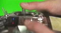 The man use the remote control for the drone on a green background. Real time 4k or 4k+ Resolution