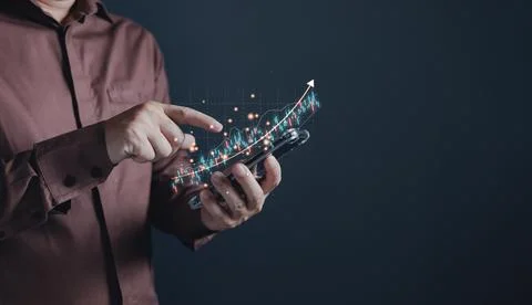 Man use tablet graphs and progress of business and analyze financial,and in.. Stock Photos