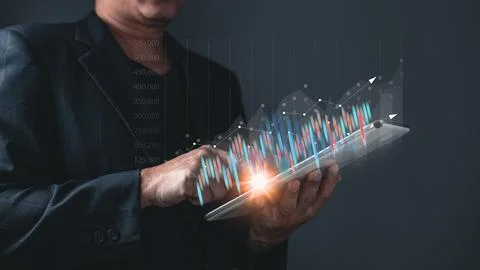 Man use taplet graphs and progress of business and analyze financial,and in.. Stock Photos