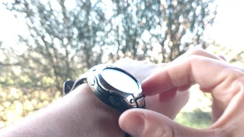 Man use trekking watch during an hiking adventure. outdoor trekking watch. Video stock 233575256