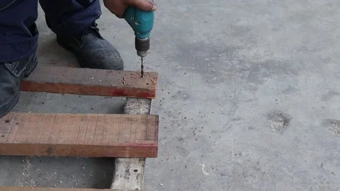Man used electric drill is drilling wooden bar Stock Footage 151242228