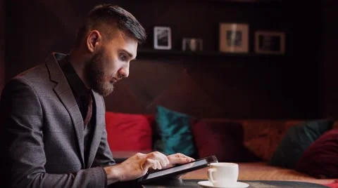Man used tablet and smart watch in cafe Stock Footage 57113816