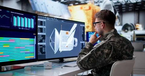 Man Uses 3D Software To Design Clean Energy Satellite Panels During Construct Stock Photos