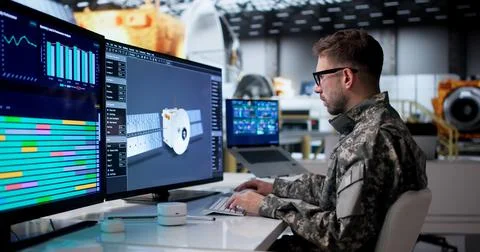 Man Uses 3D Software To Design Solar Panels For Satellite Assembly. Stock Photos