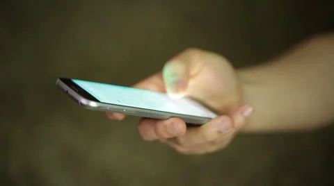 Man uses and texts on a smartphone Stock Footage 50392615