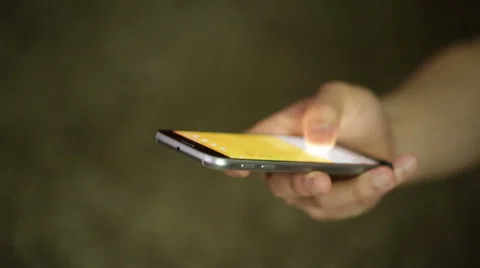Man uses and texts on a smartphone Stock Footage 50392624