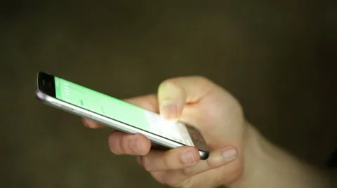 Man uses and texts on a smartphone Stock Footage 50392665