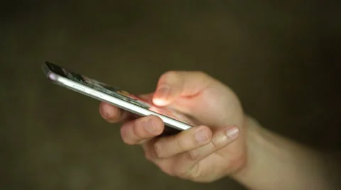 Man uses and texts on a smartphone Stock Footage 50392669