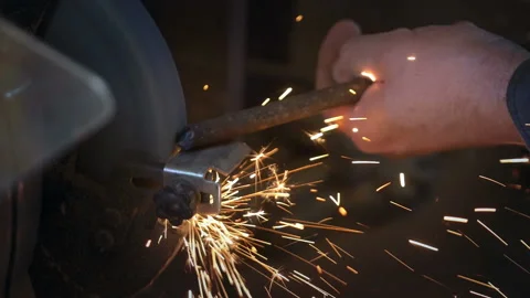 Man uses angle grinder in workshop in slow motion Stock Footage 87788221