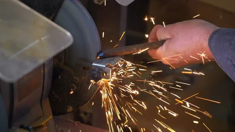 Man uses angle grinder in workshop in slow motion Stock-Footage 87811382