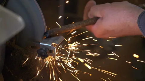 Man uses angle grinder in workshop in slow motion Stock Footage 88763410