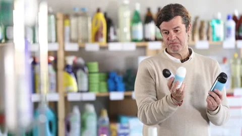 Man uses barcode to get information about liquid detergent in mobile application Stock Footage 312626779