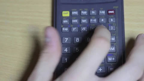 The man uses a calculator for calculations. Video stock 169810230