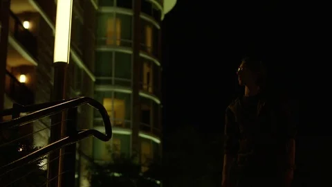 Man Uses Cell Phone at Night Stock Footage 77209225