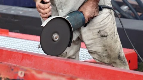 A man uses a circular saw to cut the metal. Detail. Stock Footage 69750437