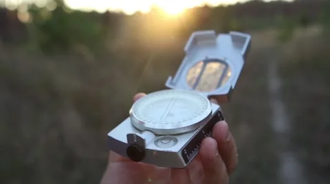 Man Uses a Compass In The Woods At Sunset Stock Footage 69060486