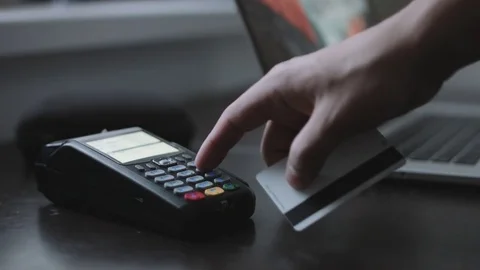 Man uses credit card terminal in office. Stock Footage
