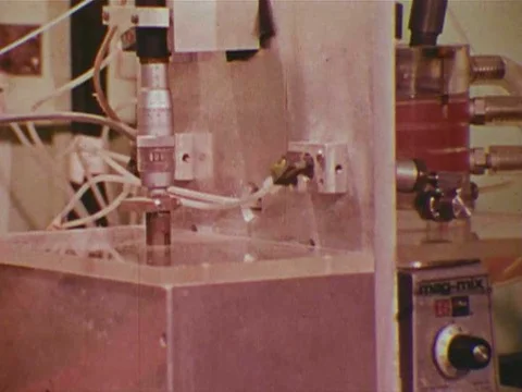 A man uses different elements as well as electronics to measure the amount of Stock Footage 74936238