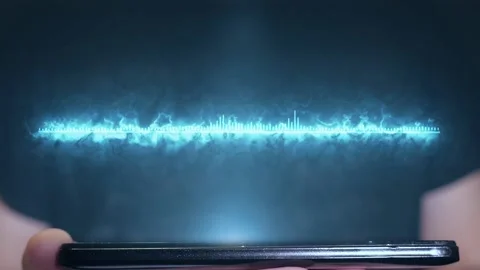 The man uses the futuristic hologram of the equalizer sound on the phone Stock Footage 104054851
