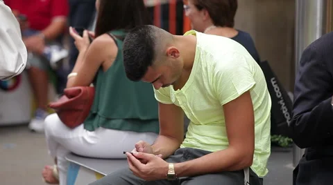 A man uses a gadget Stock Footage 61570885