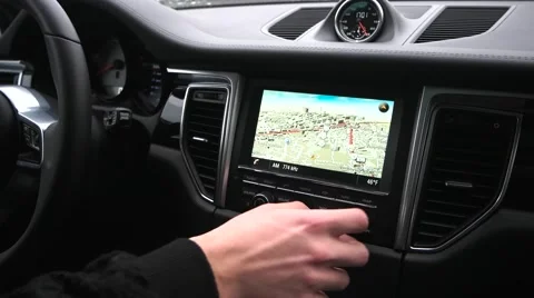 Man uses a gps navigator in the car Stock Footage 68566169