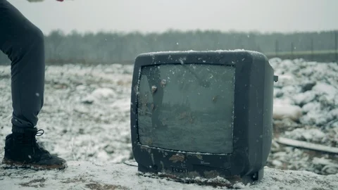 Man uses hammer to break old TV at a dump. Stock Footage 120465157